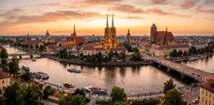 A stunning golden hour panoramic view of Wrocław's historic city skyline and Oder river, captured wi